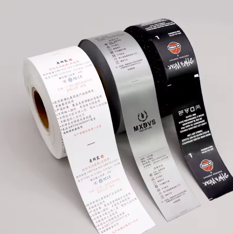Printed care and composition labels in white, silver, and black rolls