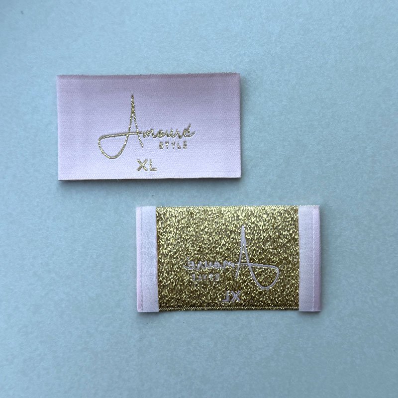 Front and back of an Amouré STYLE brand label carrying XL size text