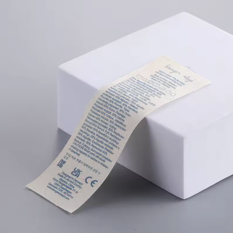 Printed care label roll showing clear text and washing symbols