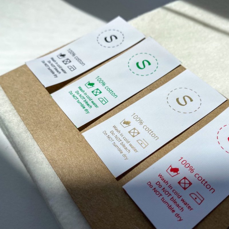 Printed size label showing an S size mark combined with care information